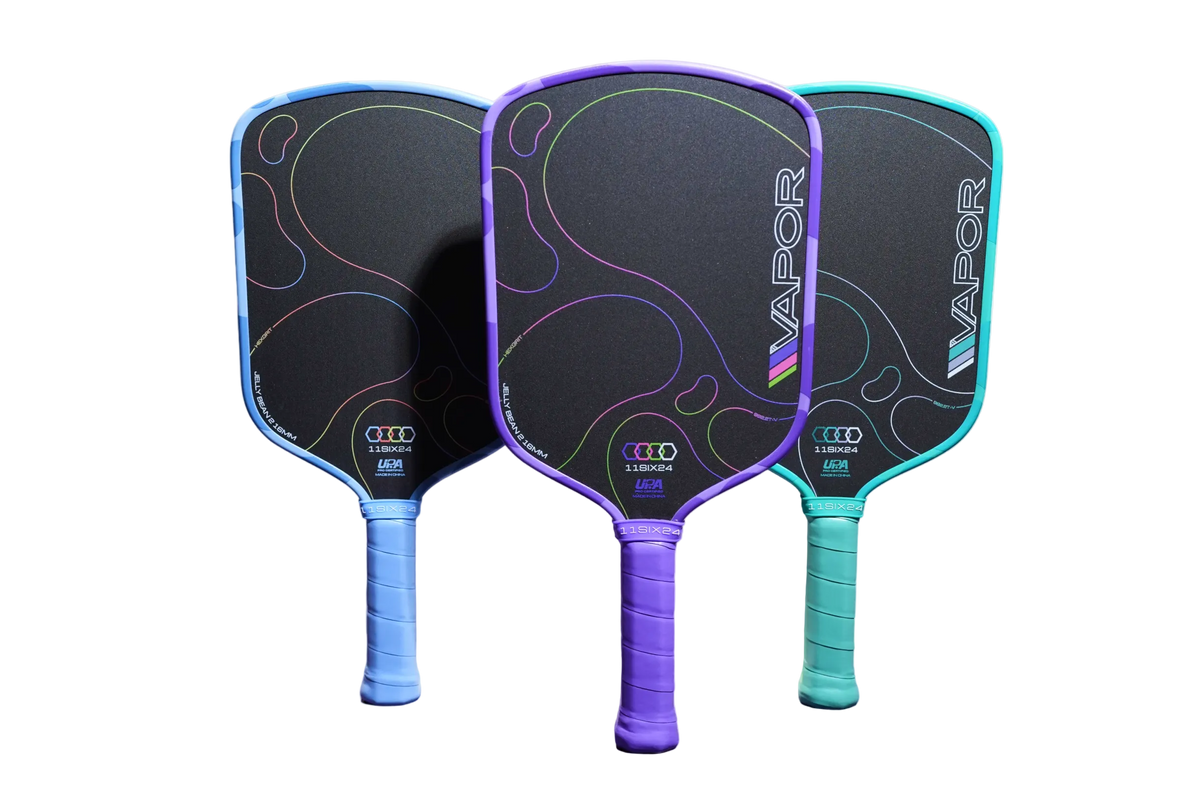 Three Vapor pickleball paddles with black textured faces and colorful outlines, shown in blue, purple, and teal with matching wrapped handles on a white background.